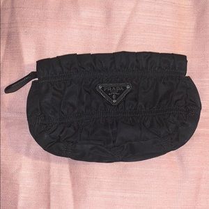 Prada pouch.